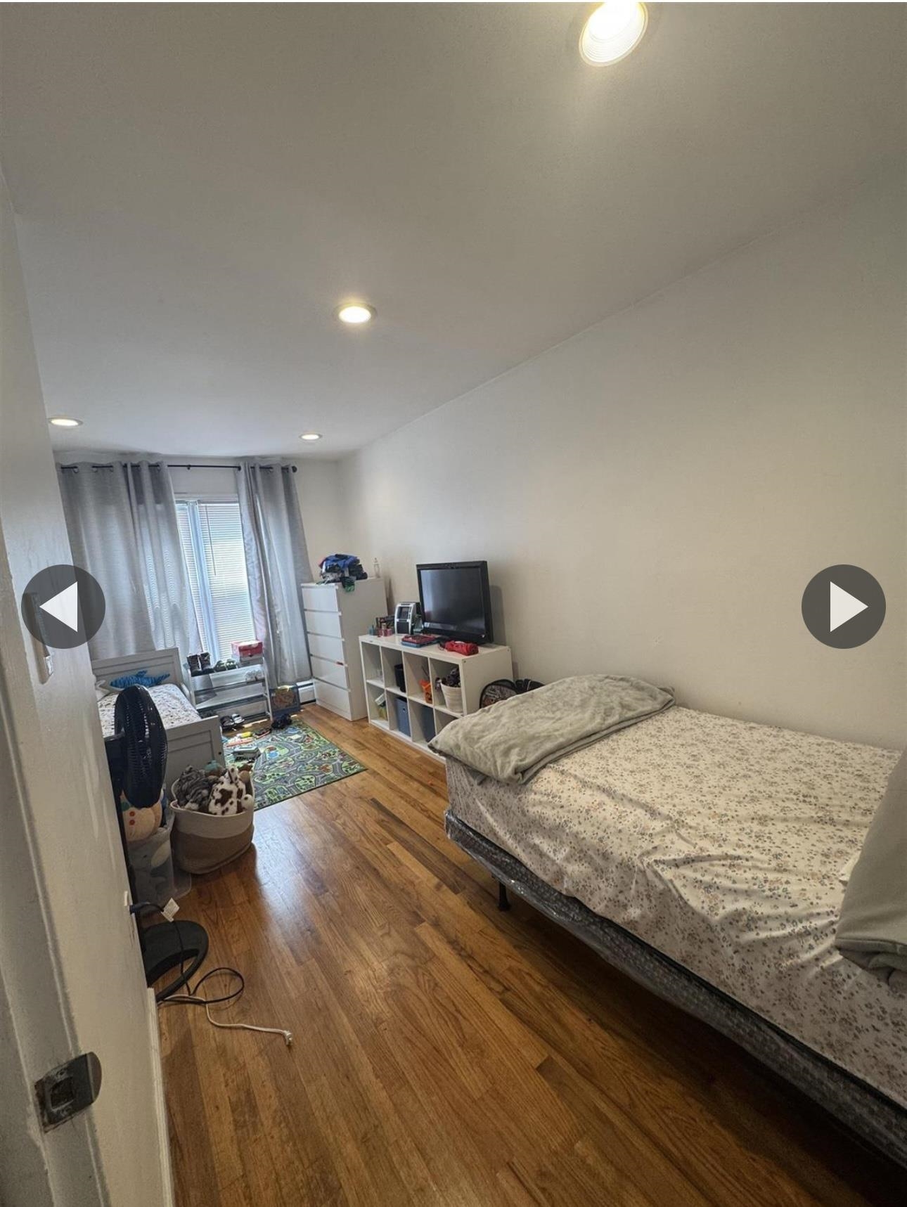 315 22nd Street Union City, NJ 07087 - Photo 8 of 11 a bedroom with a bed and furniture