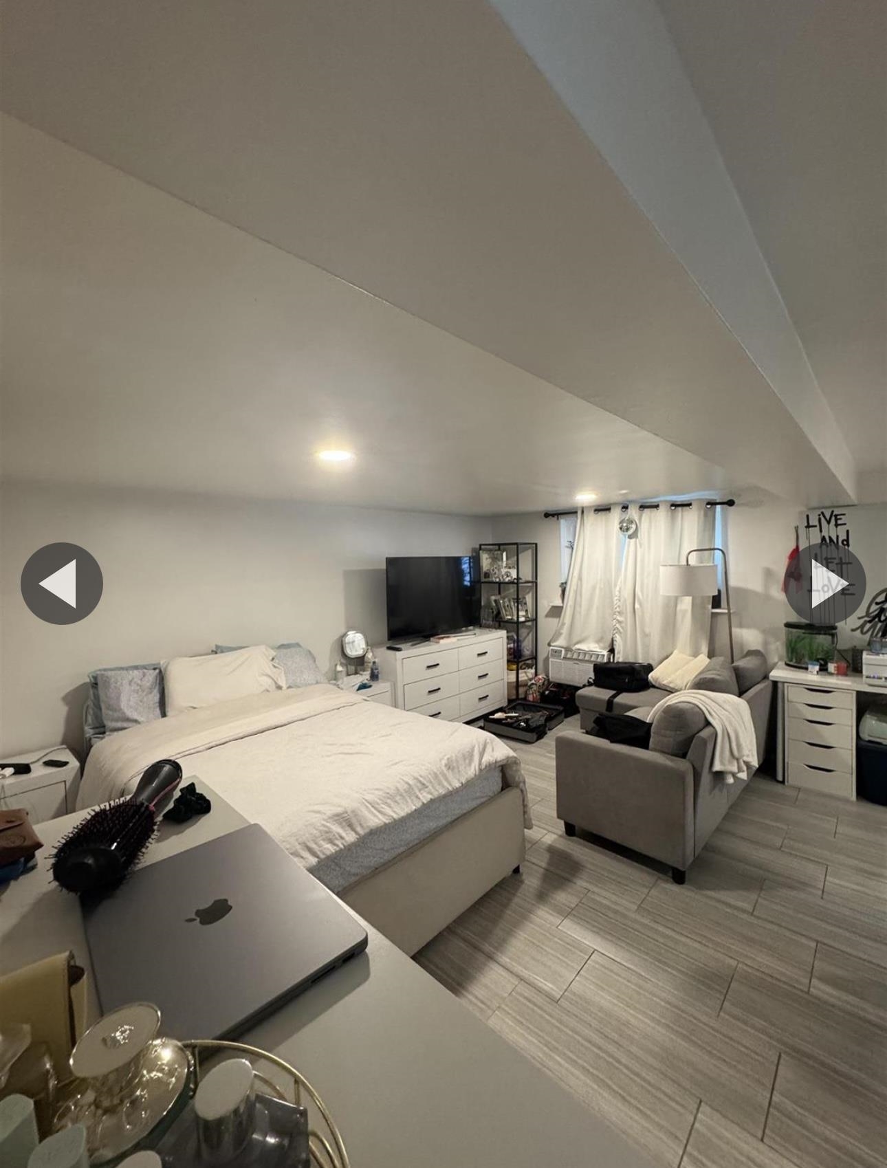 315 22nd Street Union City, NJ 07087 - Photo 9 of 11 a living room with furniture and a window