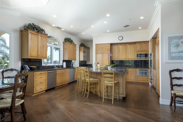 a spacious bedroom with a bed and a television