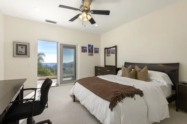 a front view of houses with yard