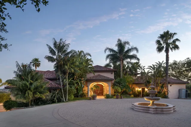a view of entryway with wooden floor and a chandelier