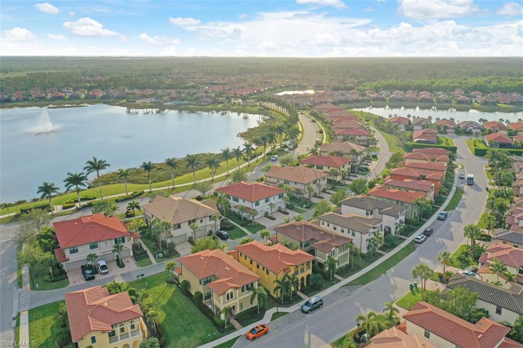 1316 Kendari Terrace Naples, FL 34113 - Photo 21 of 31 an aerial view of residential houses with outdoor space