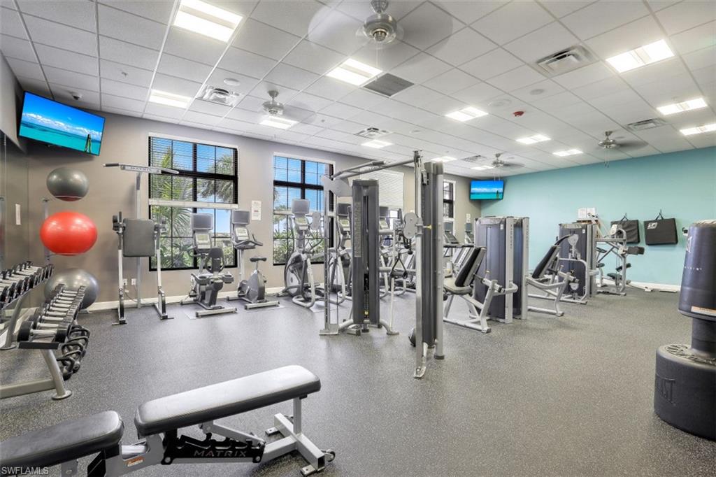 1316 Kendari Terrace Naples, FL 34113 - Photo 30 of 31 a view of a room with gym equipment