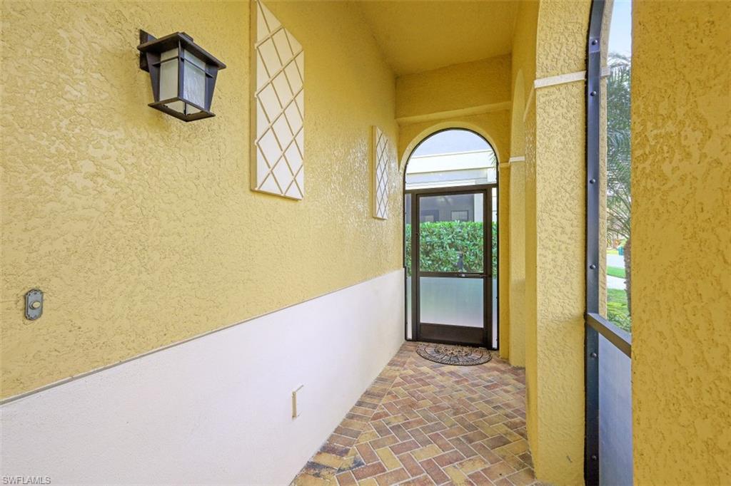 1316 Kendari Terrace Naples, FL 34113 - Photo 3 of 31 a view of entryway with wooden floor