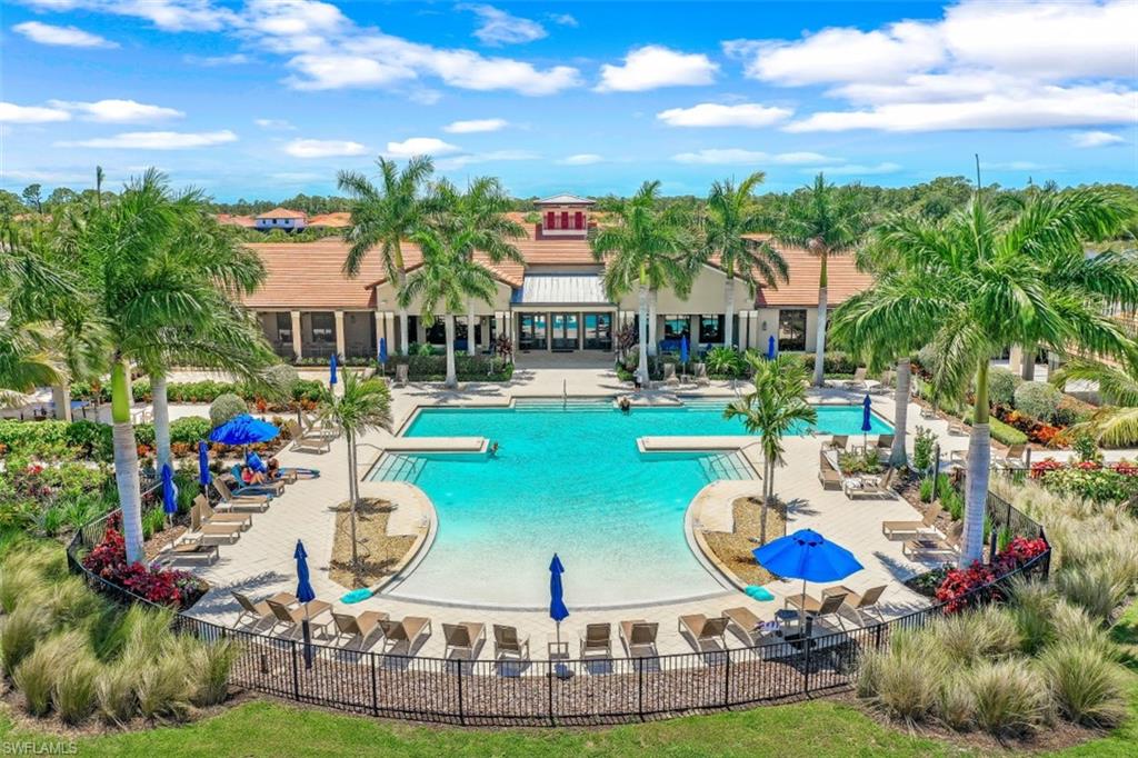 1316 Kendari Terrace Naples, FL 34113 - Photo 31 of 31 a view of a swimming pool and outdoor seating