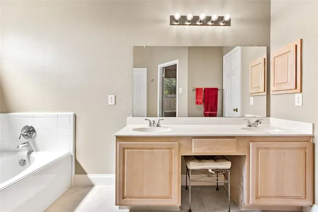 a bathroom with a sink and a bathtub