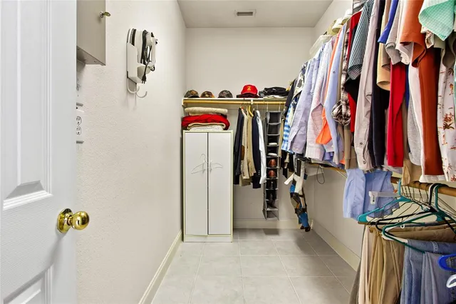 a view of a closet with storage