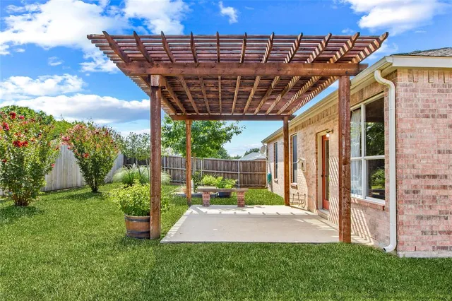 a patio with a yard table and chairs