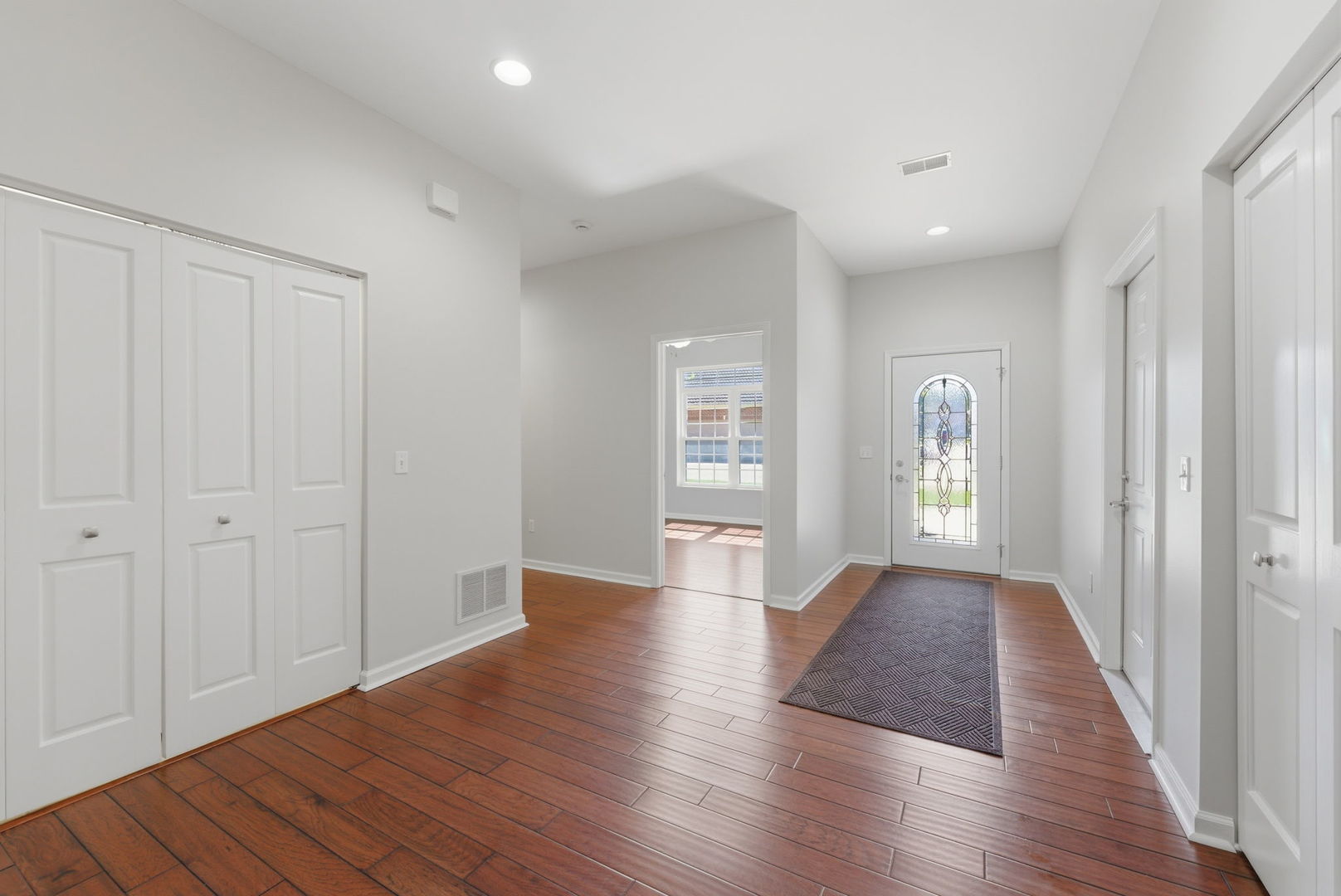 1002 2nd St Court Moline, IL 61265 - Photo 17 of 31 a view of an empty room with wooden floor and a window