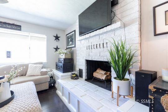 1021 West Iowa Avenue Ridgecrest, CA 93555 - Photo 11 of 40 a living room with furniture fireplace and potted plant