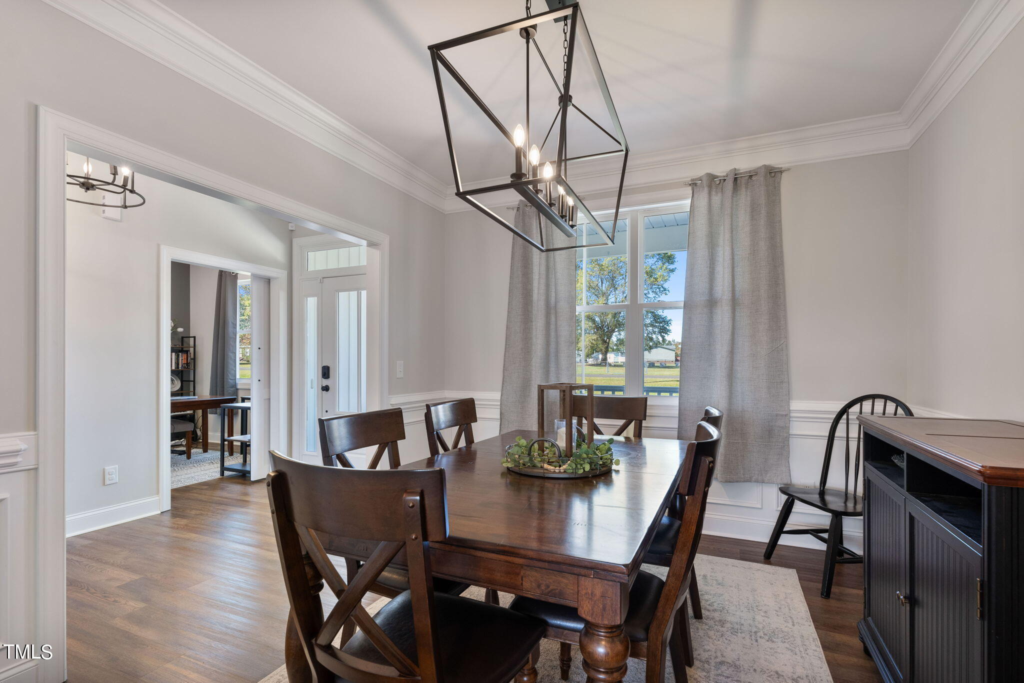 6217 Mal Weathers Road Raleigh, NC 27603 - Photo 17 of 59 a view of a dining room with furniture window and wooden floor