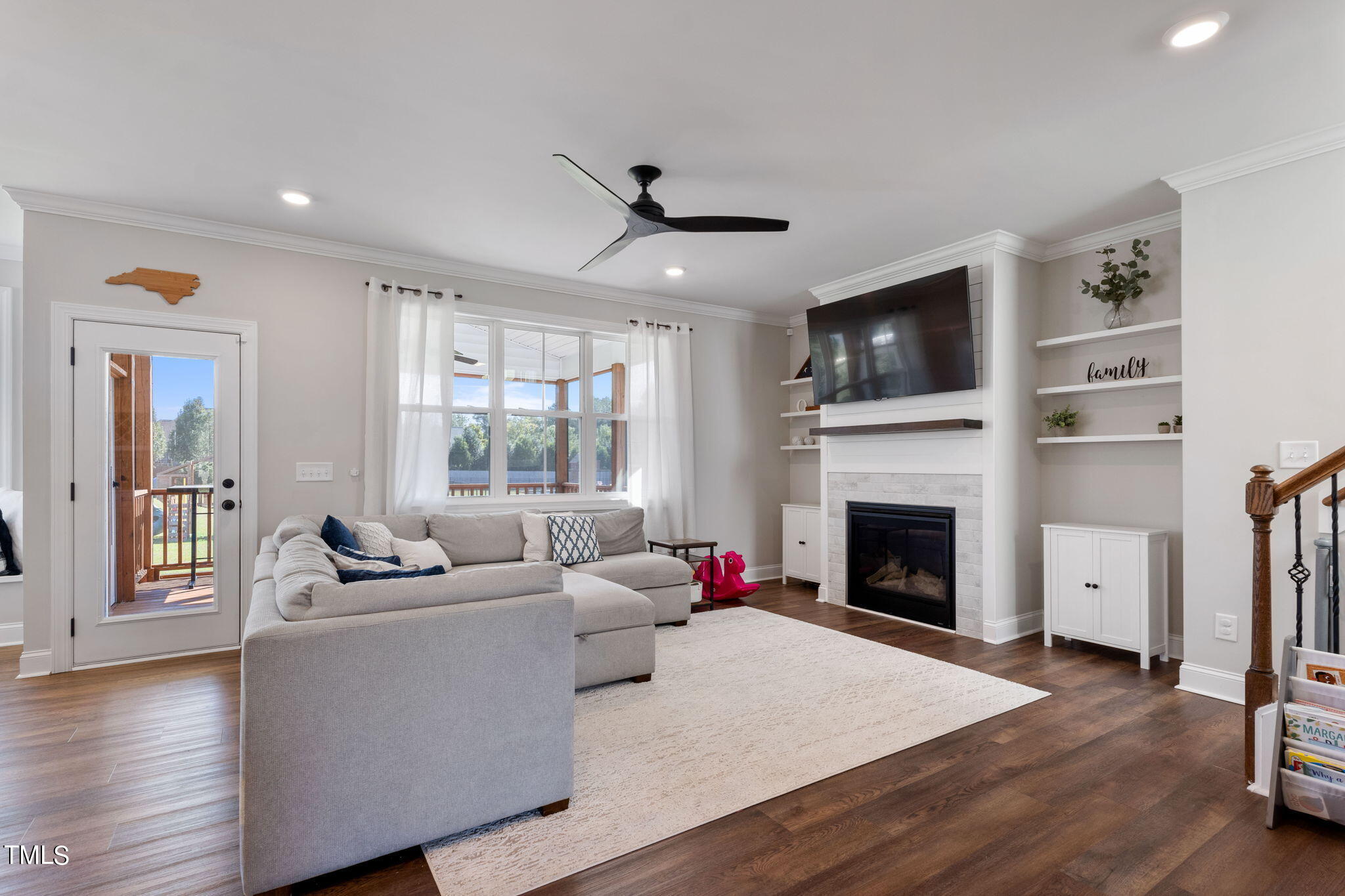 6217 Mal Weathers Road Raleigh, NC 27603 - Photo 18 of 59 a living room with furniture fireplace and flat screen tv