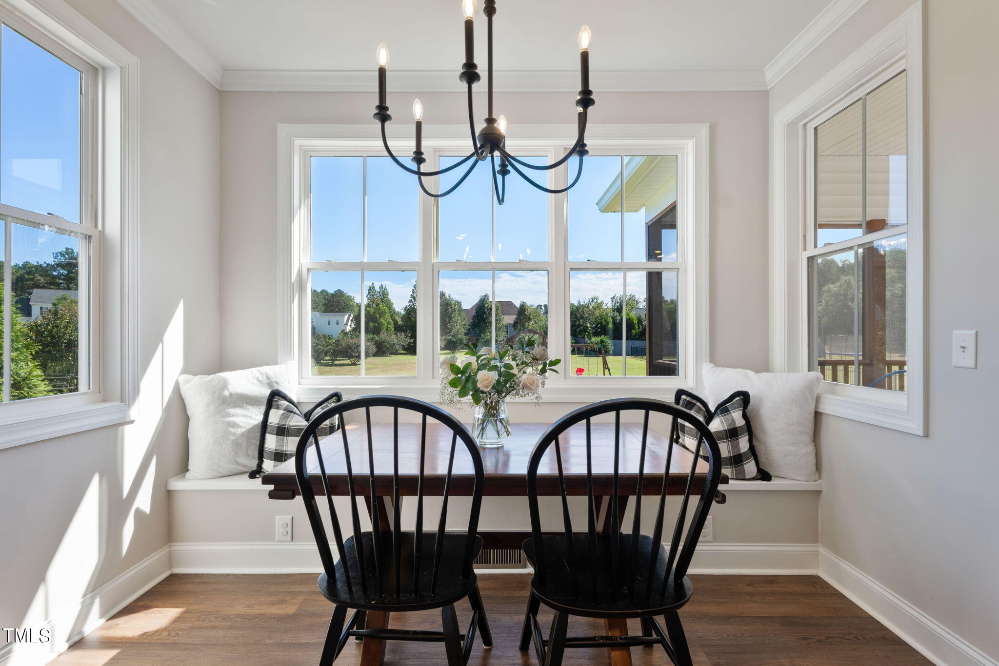 6217 Mal Weathers Road Raleigh, NC 27603 - Photo 28 of 59 a view of a dining room with furniture window and wooden floor