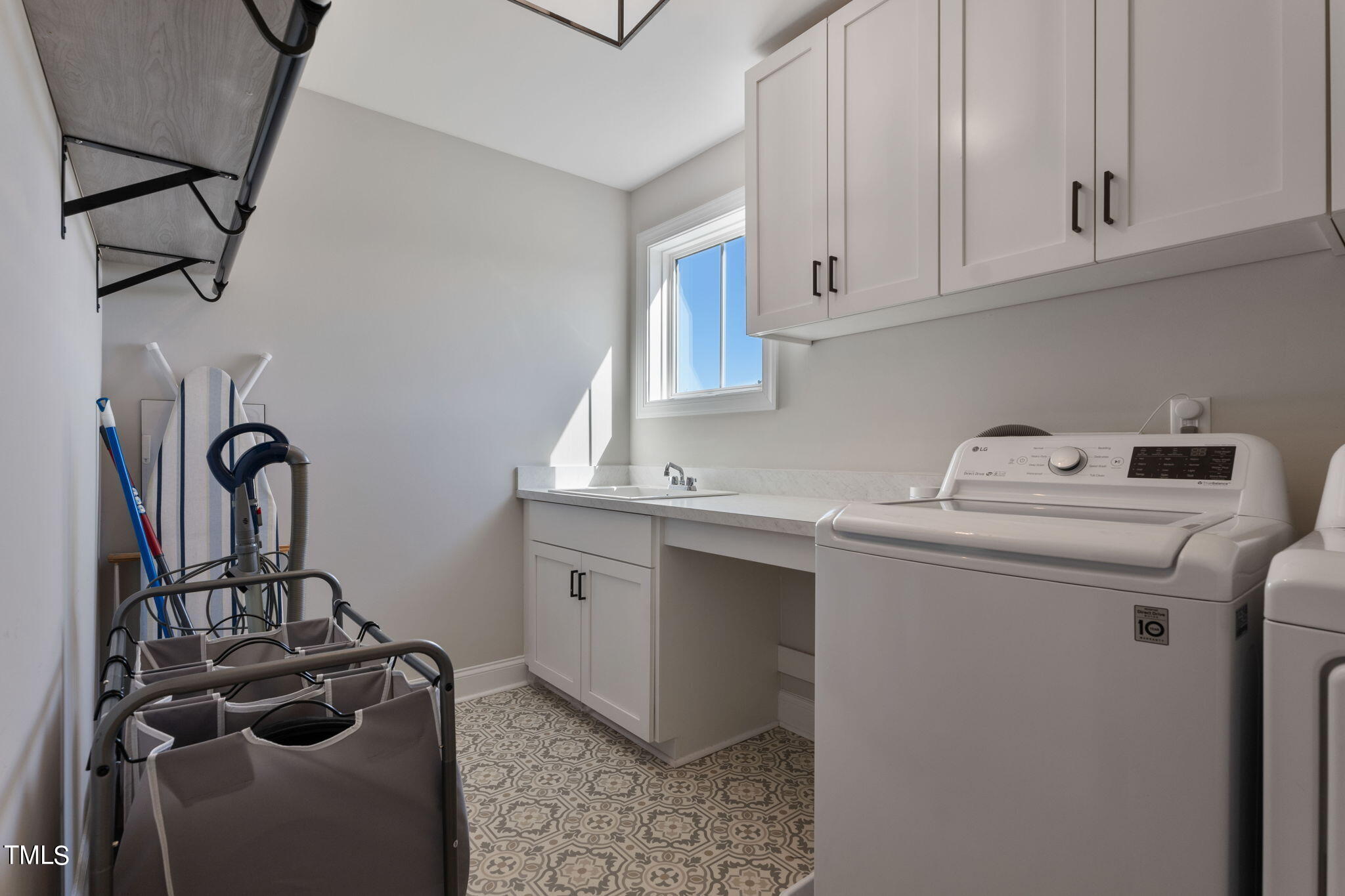 6217 Mal Weathers Road Raleigh, NC 27603 - Photo 42 of 59 a utility room with sink dryer and washer