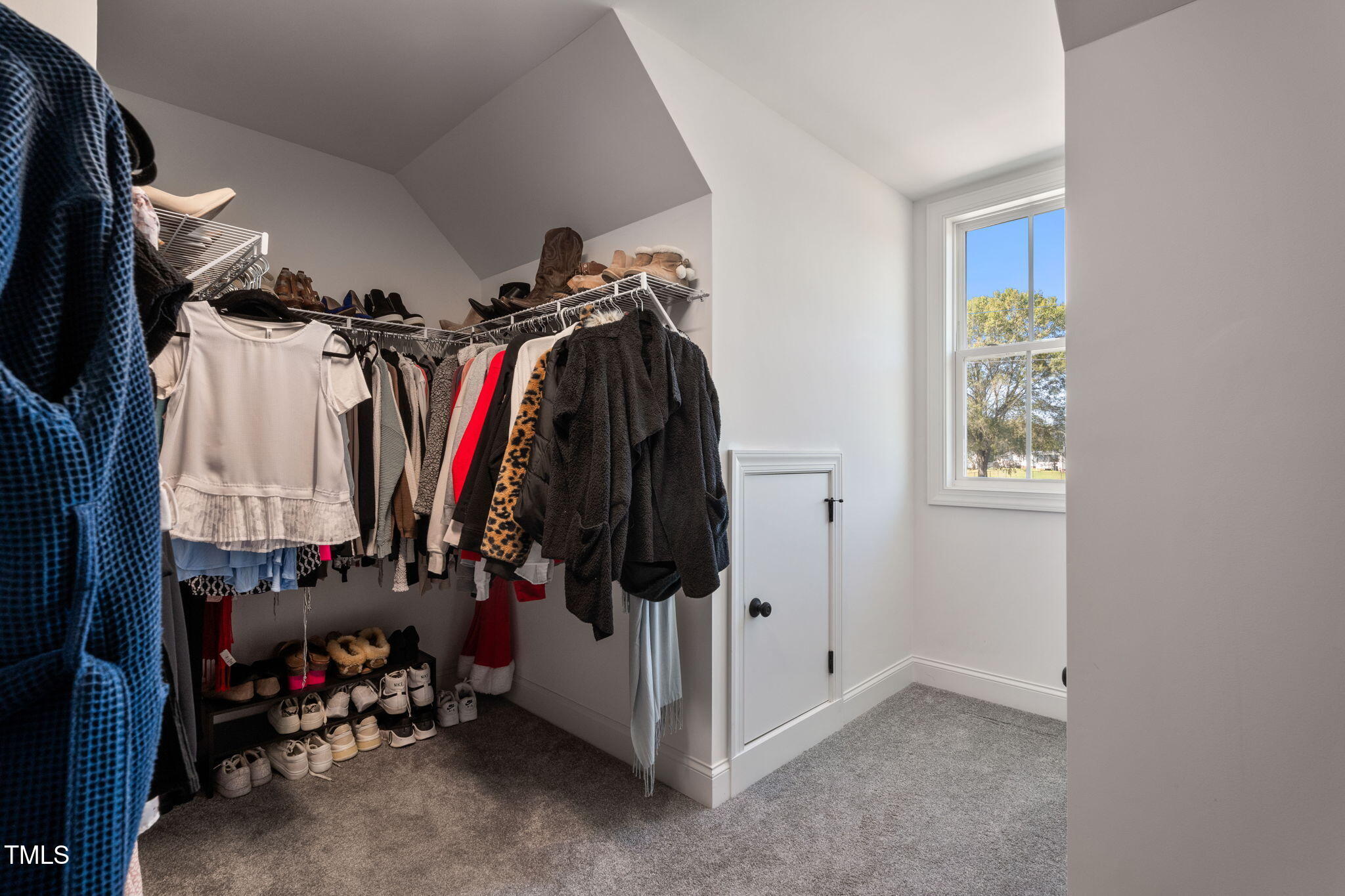 6217 Mal Weathers Road Raleigh, NC 27603 - Photo 54 of 59 a view of walk in closet with clothes and shoes
