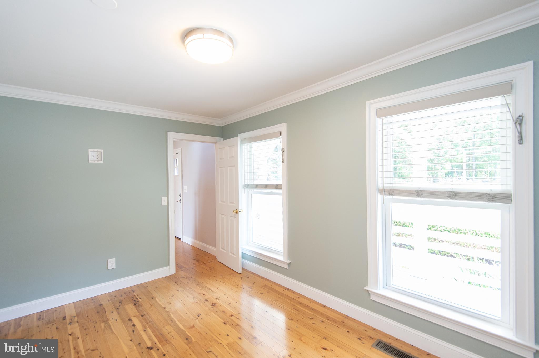 6106 Twin Point Cove Road Cambridge, MD 21613 - Photo 36 of 120 1st floor bedroom with wood floors