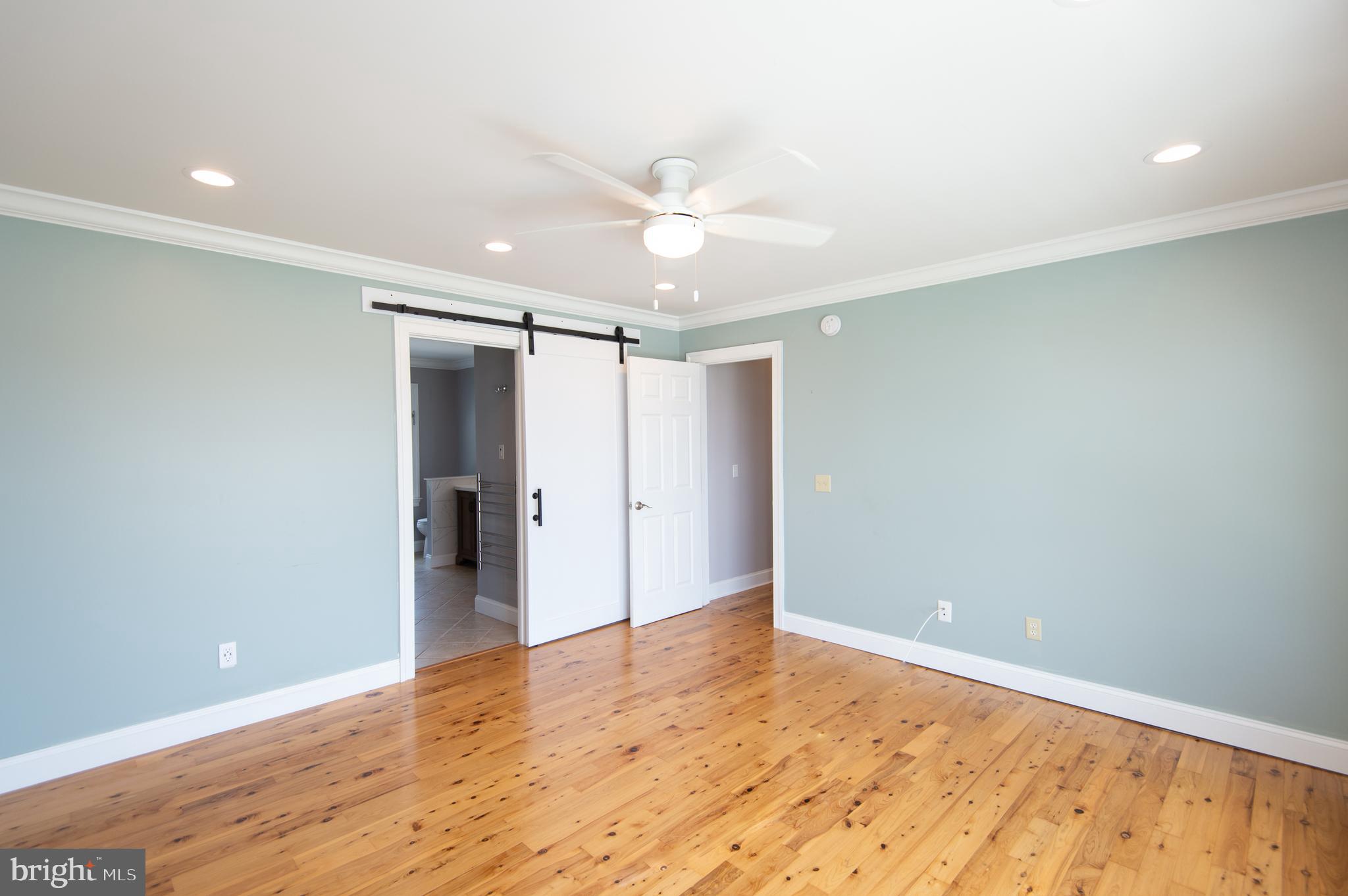6106 Twin Point Cove Road Cambridge, MD 21613 - Photo 47 of 120 Primary bedroom suite with wood floors
