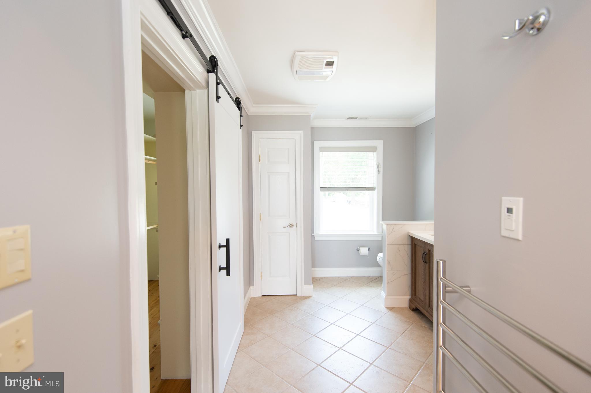 6106 Twin Point Cove Road Cambridge, MD 21613 - Photo 49 of 120 Primary bath with heated towel rack