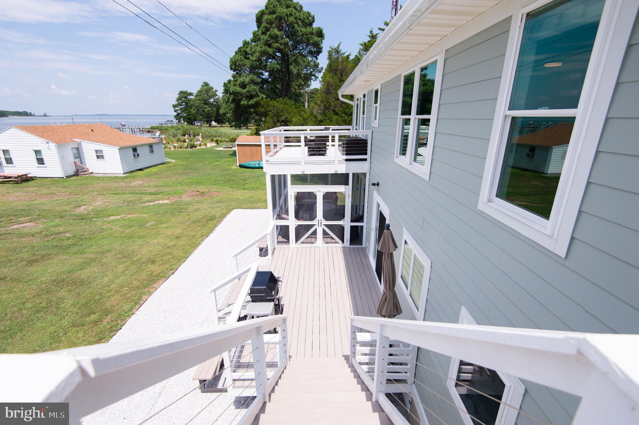 6106 Twin Point Cove Road Cambridge, MD 21613 - Photo 71 of 120 Recreation Room Deck with steps to lower level dec