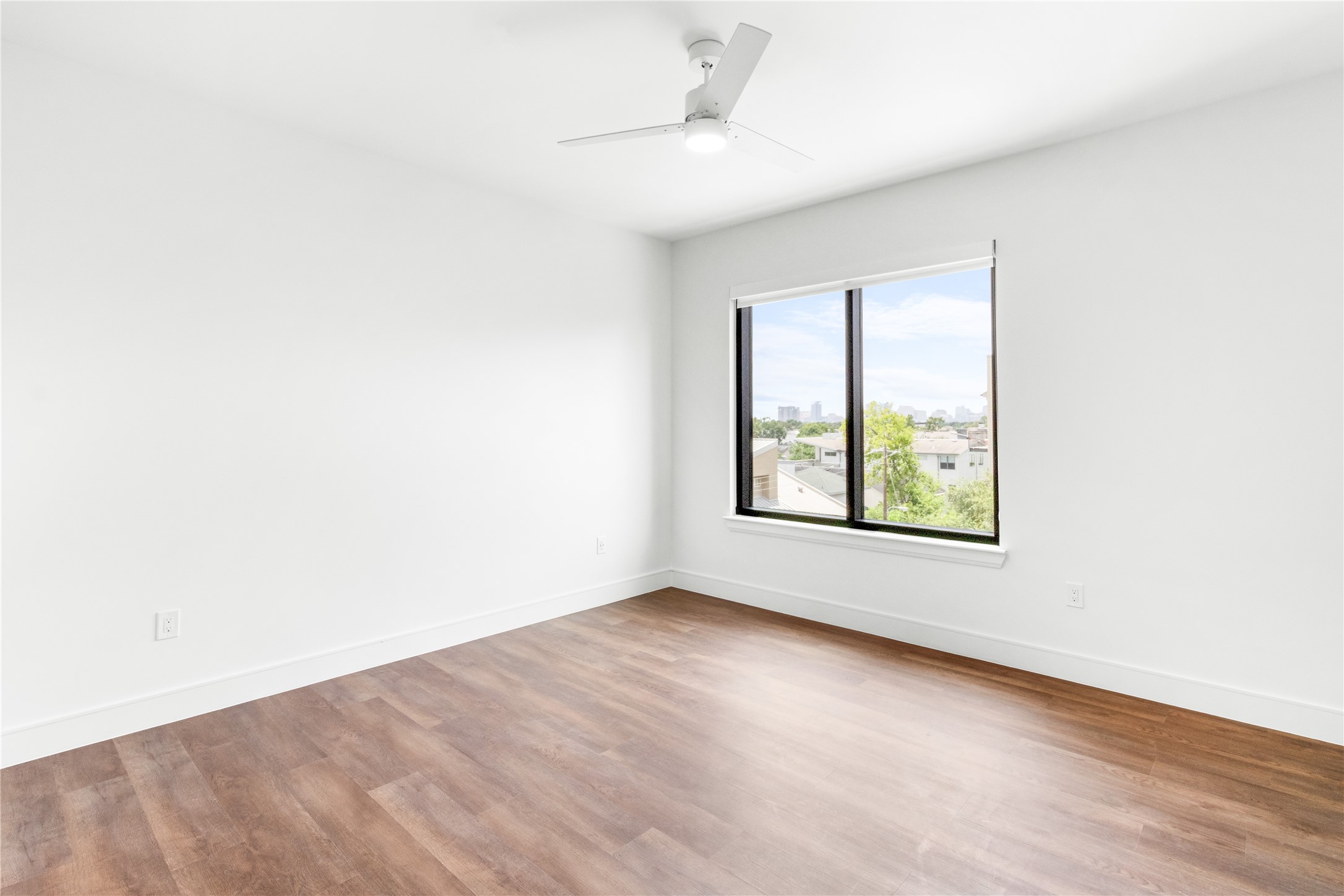 2311 Westheimer Road, Unit 529 Houston, TX 77098 - Photo 23 of 33 an empty room with a window