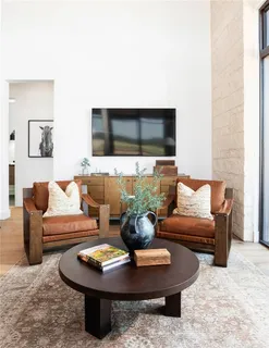 a room with furniture and a floor to ceiling window