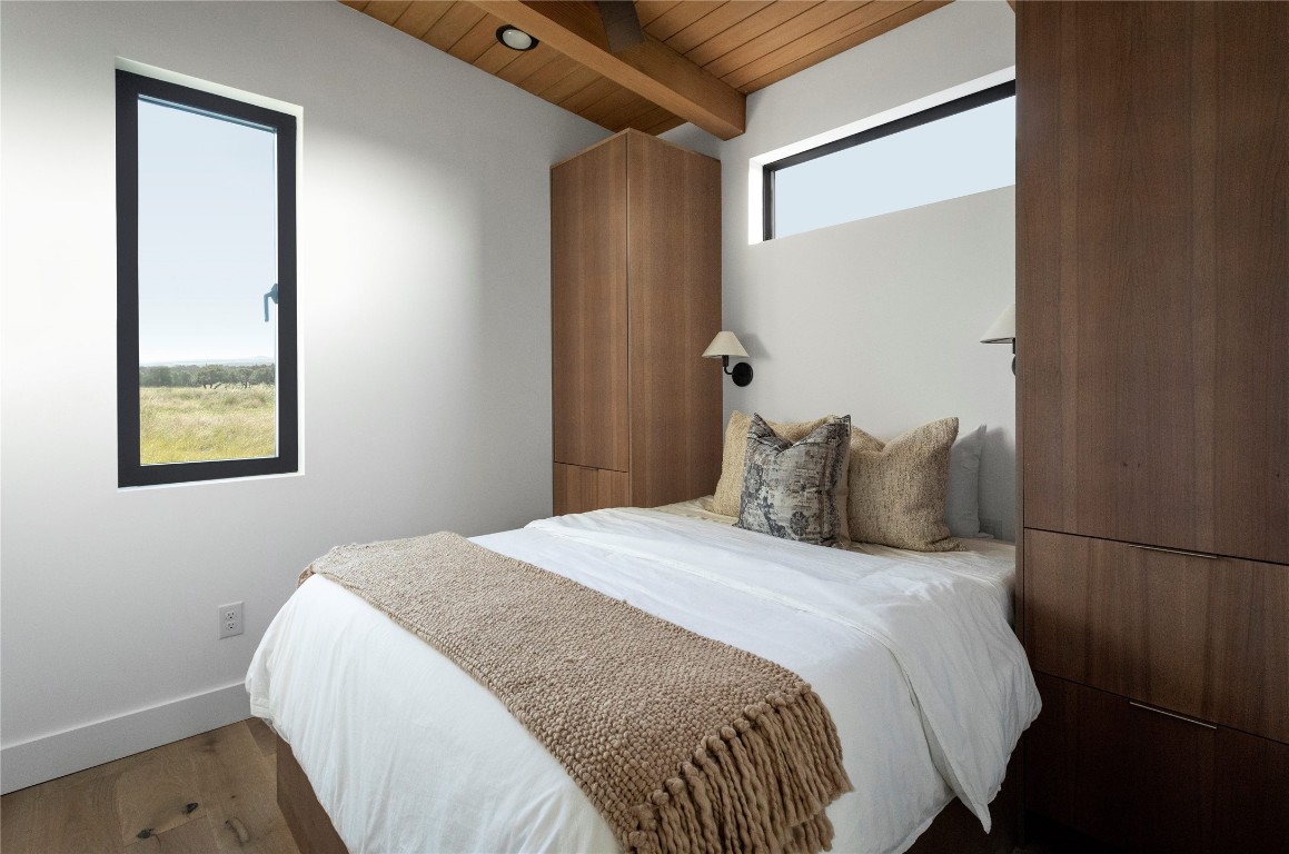 9361 Highway 290, Unit 6 Hye, TX 78635 - Photo 30 of 40 a bedroom with a bed and a window