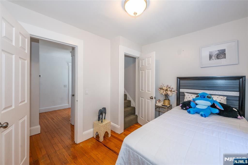 690 Garden Street Maywood, NJ 07607 - Photo 35 of 49 a bed room with furniture and a window