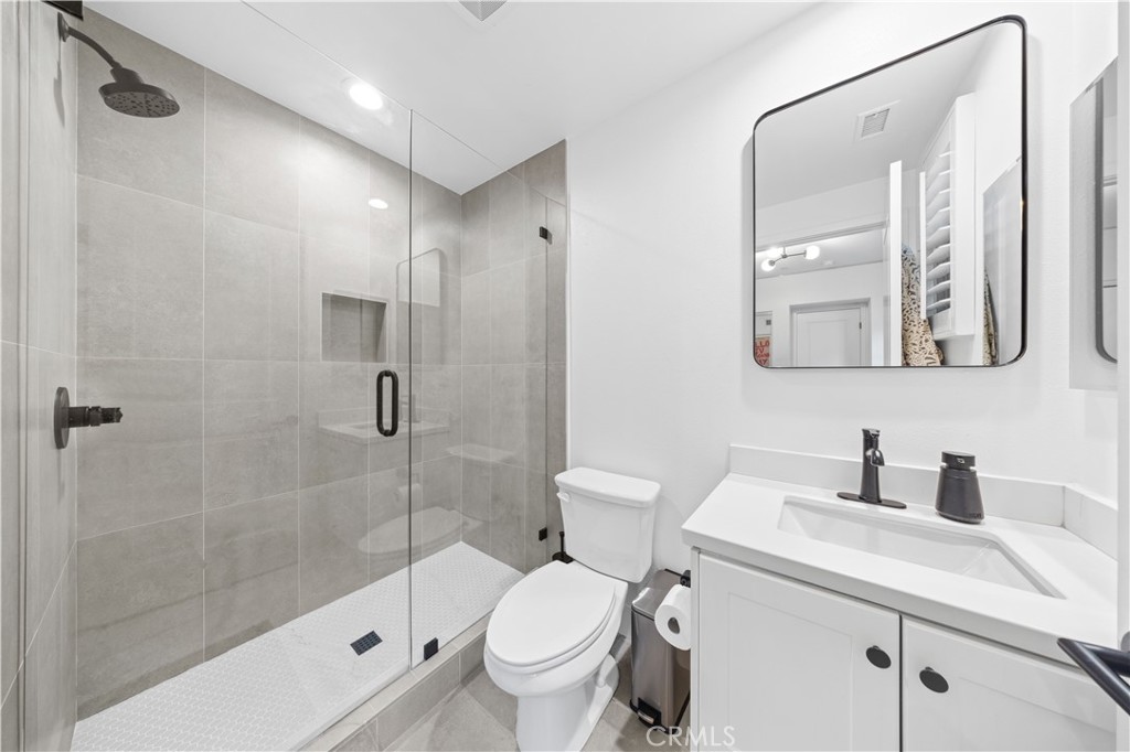 89 Kestrel Irvine, CA 92618 - Photo 11 of 45 a bathroom with a sink toilet and shower