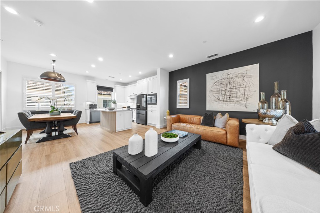 89 Kestrel Irvine, CA 92618 - Photo 17 of 45 a living room with furniture and a table