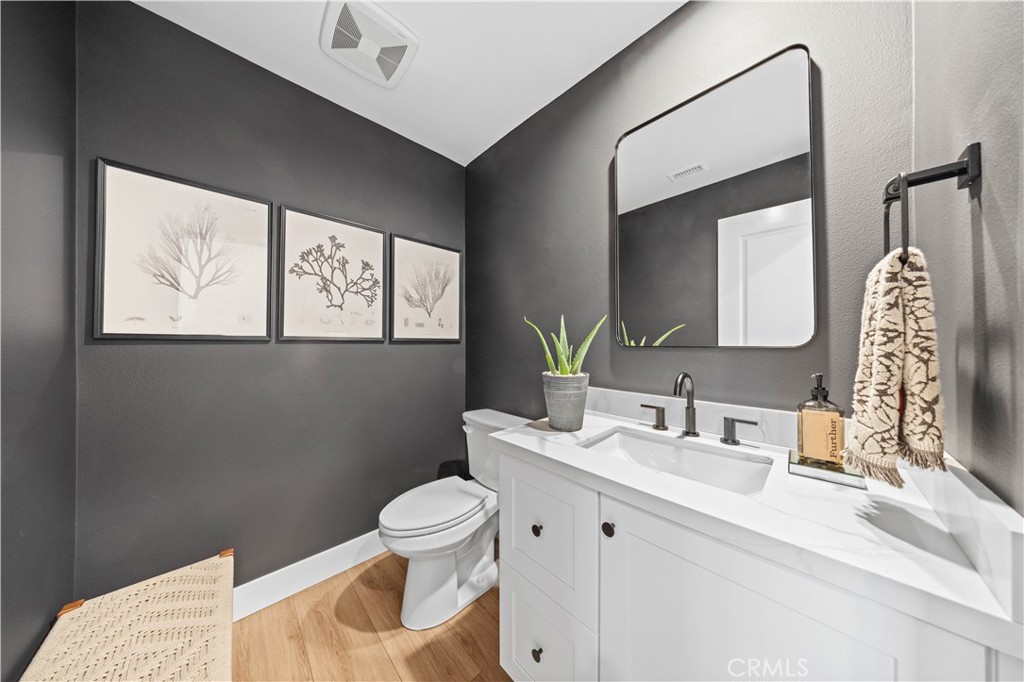 89 Kestrel Irvine, CA 92618 - Photo 22 of 45 a bathroom with a toilet sink and mirror