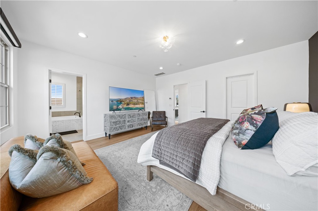 89 Kestrel Irvine, CA 92618 - Photo 32 of 45 a bedroom with a bed and a couch