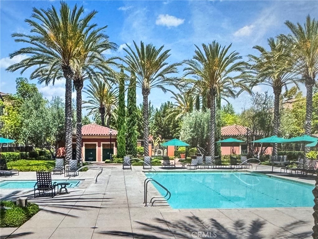 89 Kestrel Irvine, CA 92618 - Photo 37 of 45 a house with a garden and palm trees