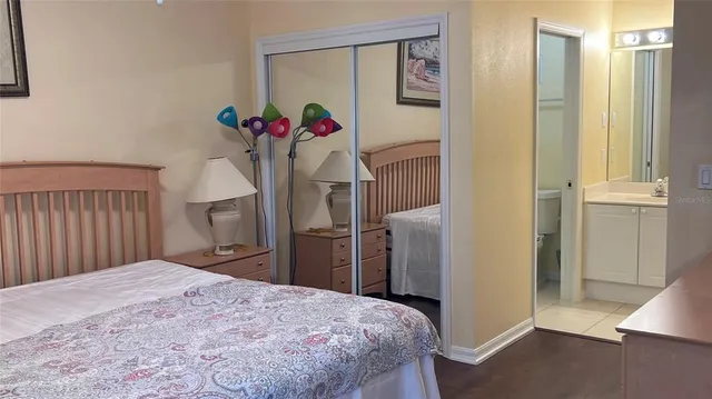 a bedroom with a bed and a closet