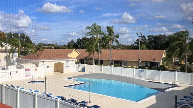 a view of a swimming pool and a chairs