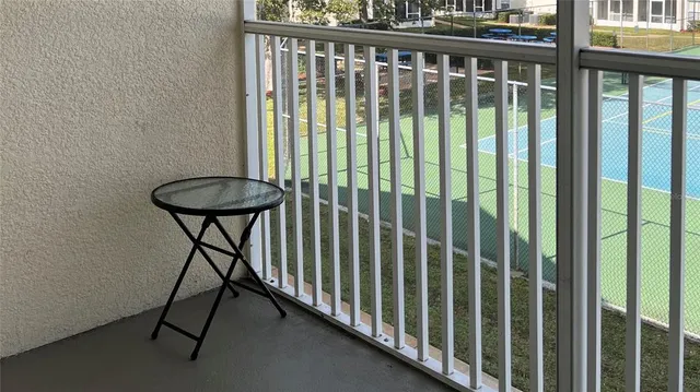 a view of a balcony with furniture