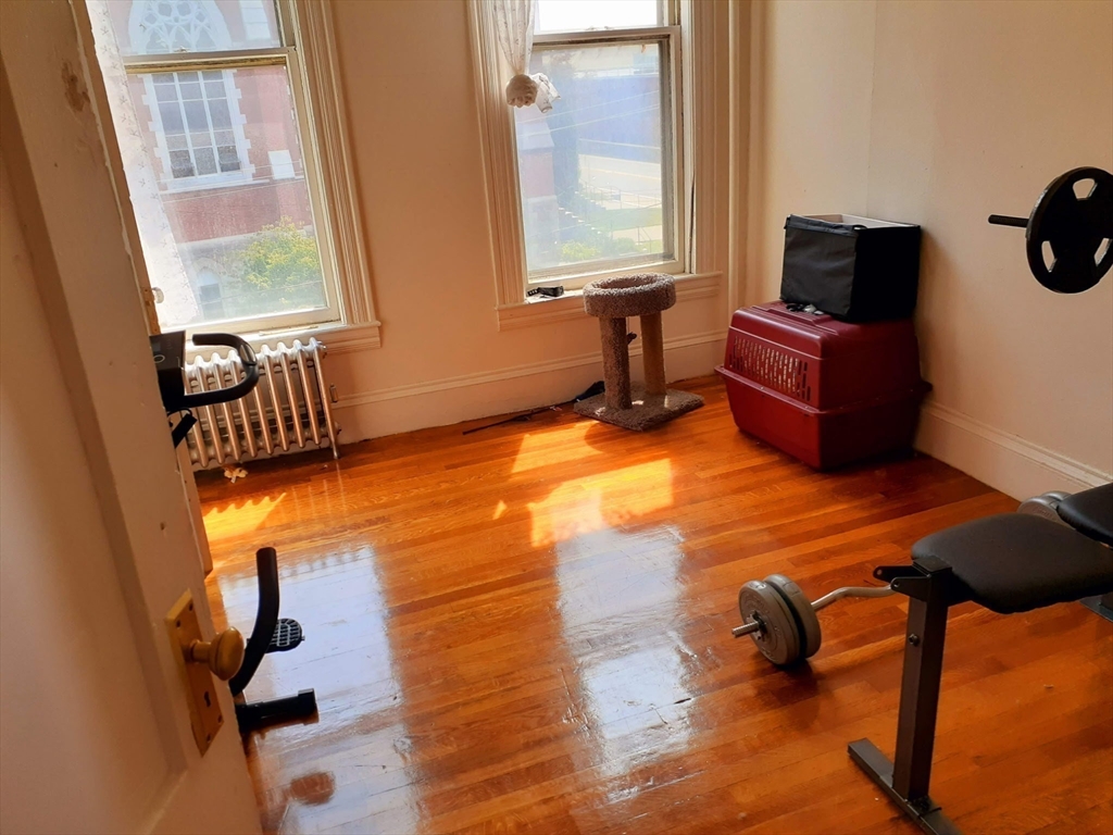 112 School Street Clinton, MA 01510 - Photo 12 of 20 a bedroom with furniture and a window