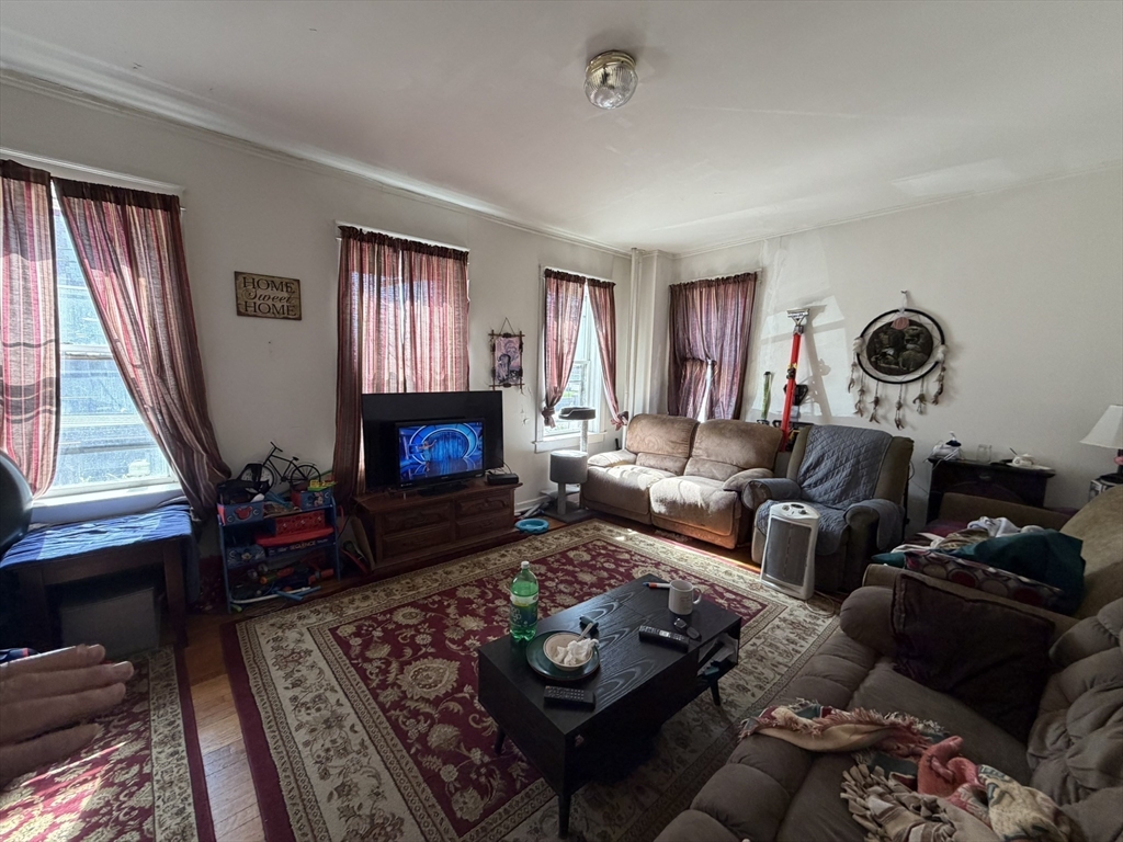 112 School Street Clinton, MA 01510 - Photo 13 of 20 a living room with furniture and a fireplace