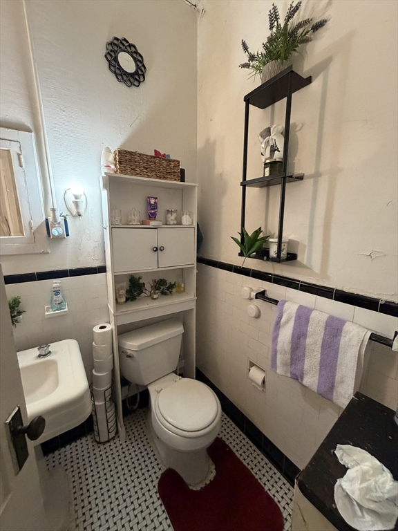 112 School Street Clinton, MA 01510 - Photo 17 of 20 a bathroom with a toilet a sink and mirror