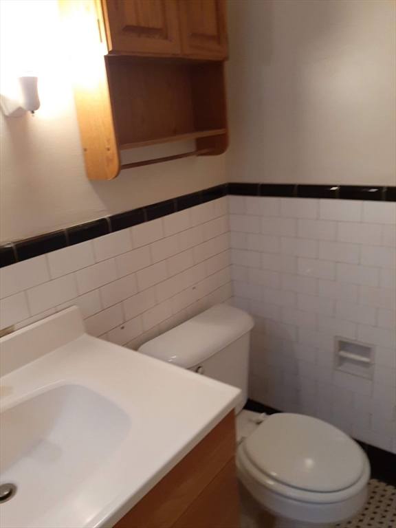 112 School Street Clinton, MA 01510 - Photo 19 of 20 a bathroom with a toilet and a sink
