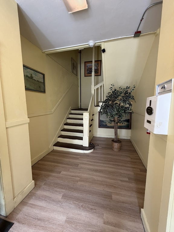 112 School Street Clinton, MA 01510 - Photo 4 of 20 a view of entryway and hall with wooden floor