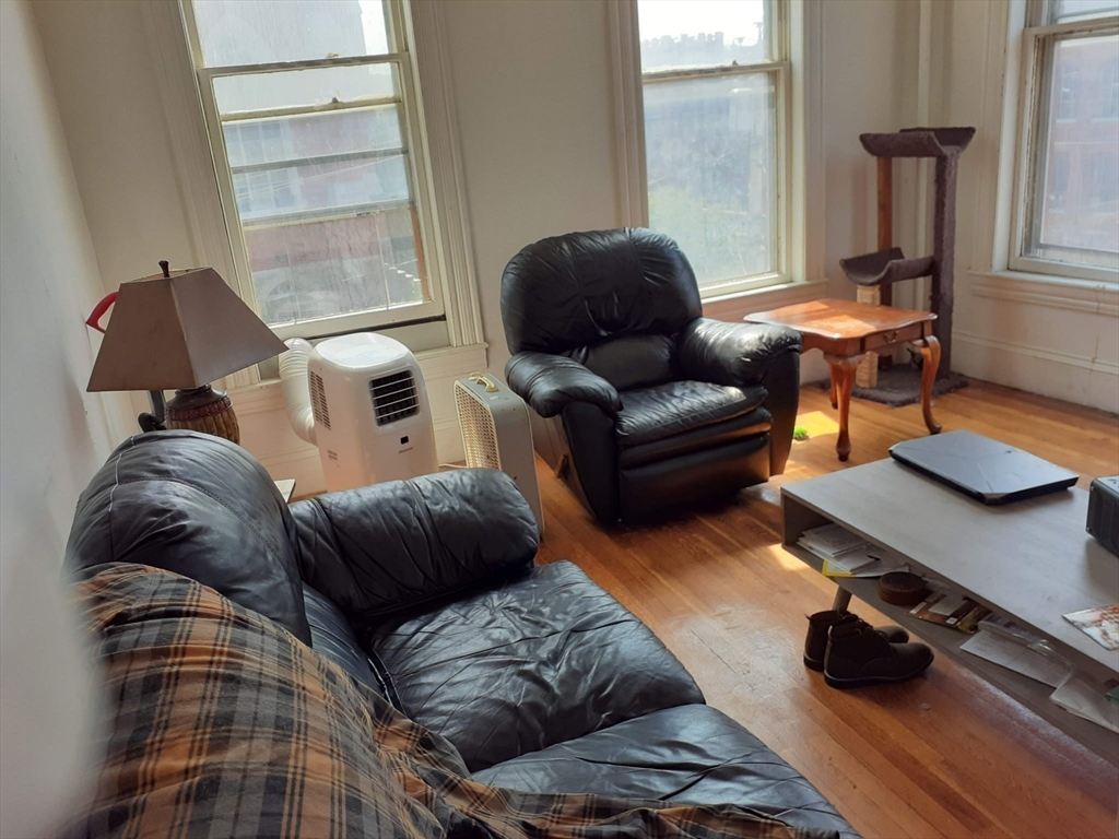 112 School Street Clinton, MA 01510 - Photo 9 of 20 a living room with furniture and a window