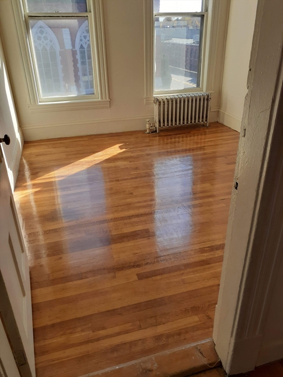 112 School Street Clinton, MA 01510 - Photo 10 of 20 a view of wooden floor and windows in a room