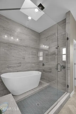 a white bath tub sitting in a bathroom