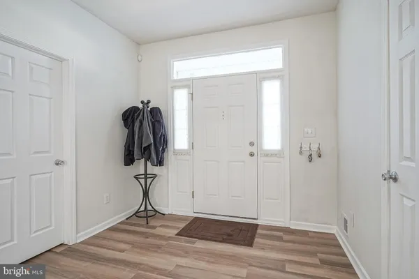 a view of entryway with wooden floor