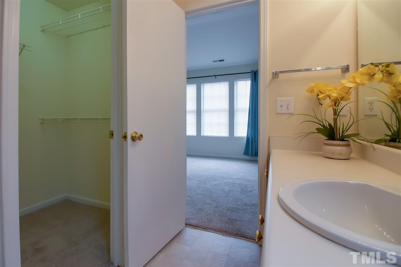 2905 Oneida Court Raleigh, NC 27610 - Photo 12 of 21 a bathroom with a sink and a mirror