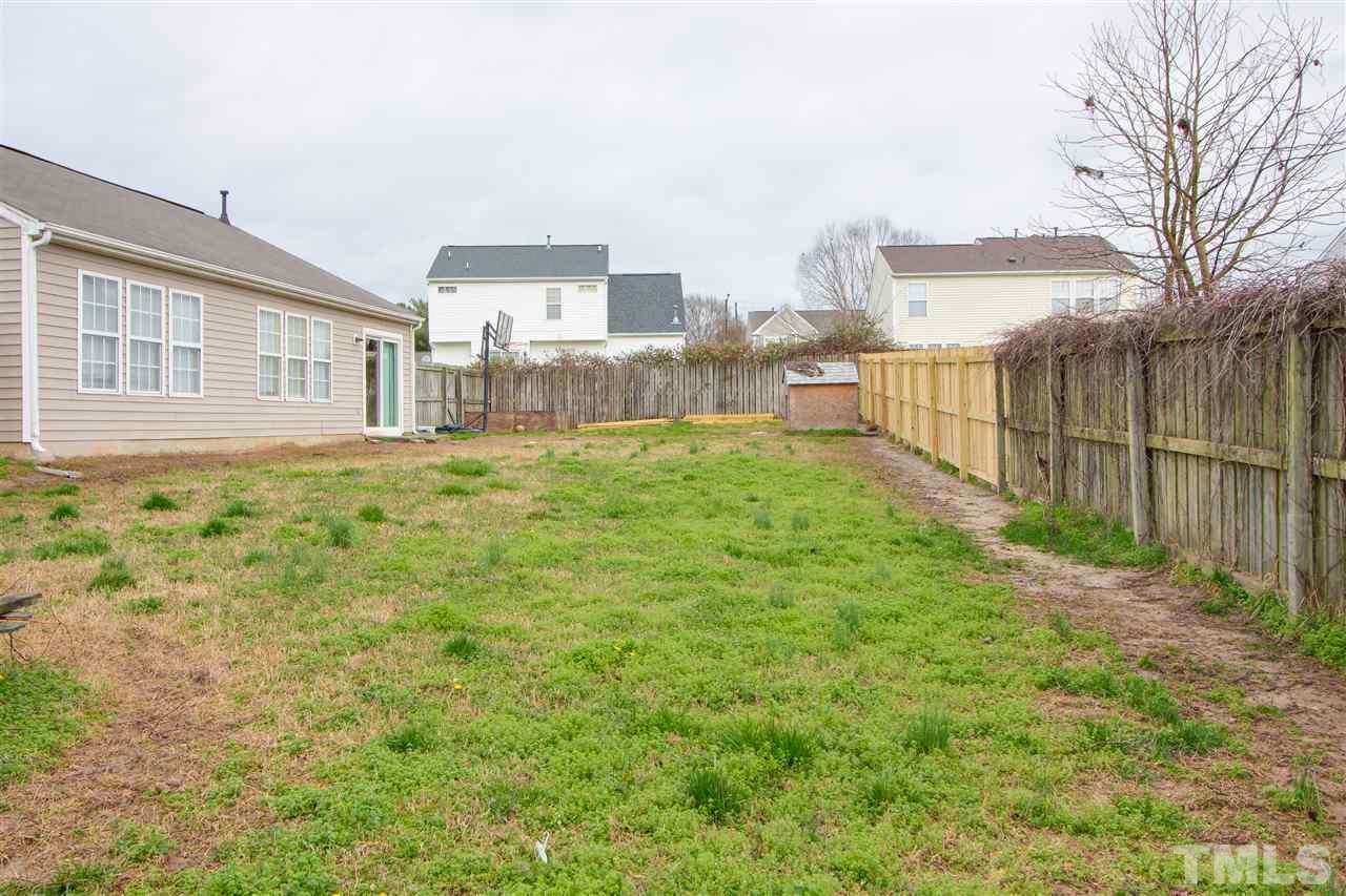 2905 Oneida Court Raleigh, NC 27610 - Photo 20 of 21 a view of a house with a yard and sitting area