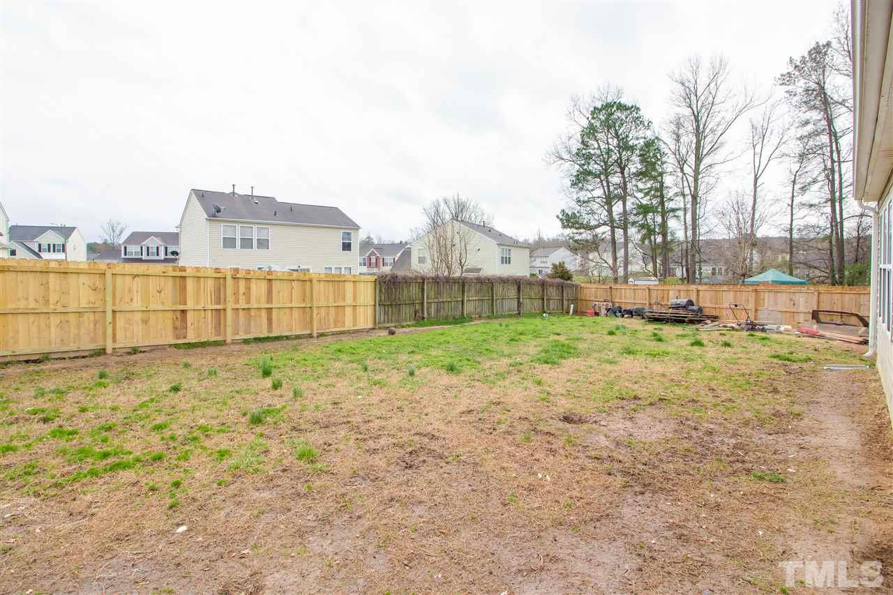 2905 Oneida Court Raleigh, NC 27610 - Photo 21 of 21 a view of a yard with a house