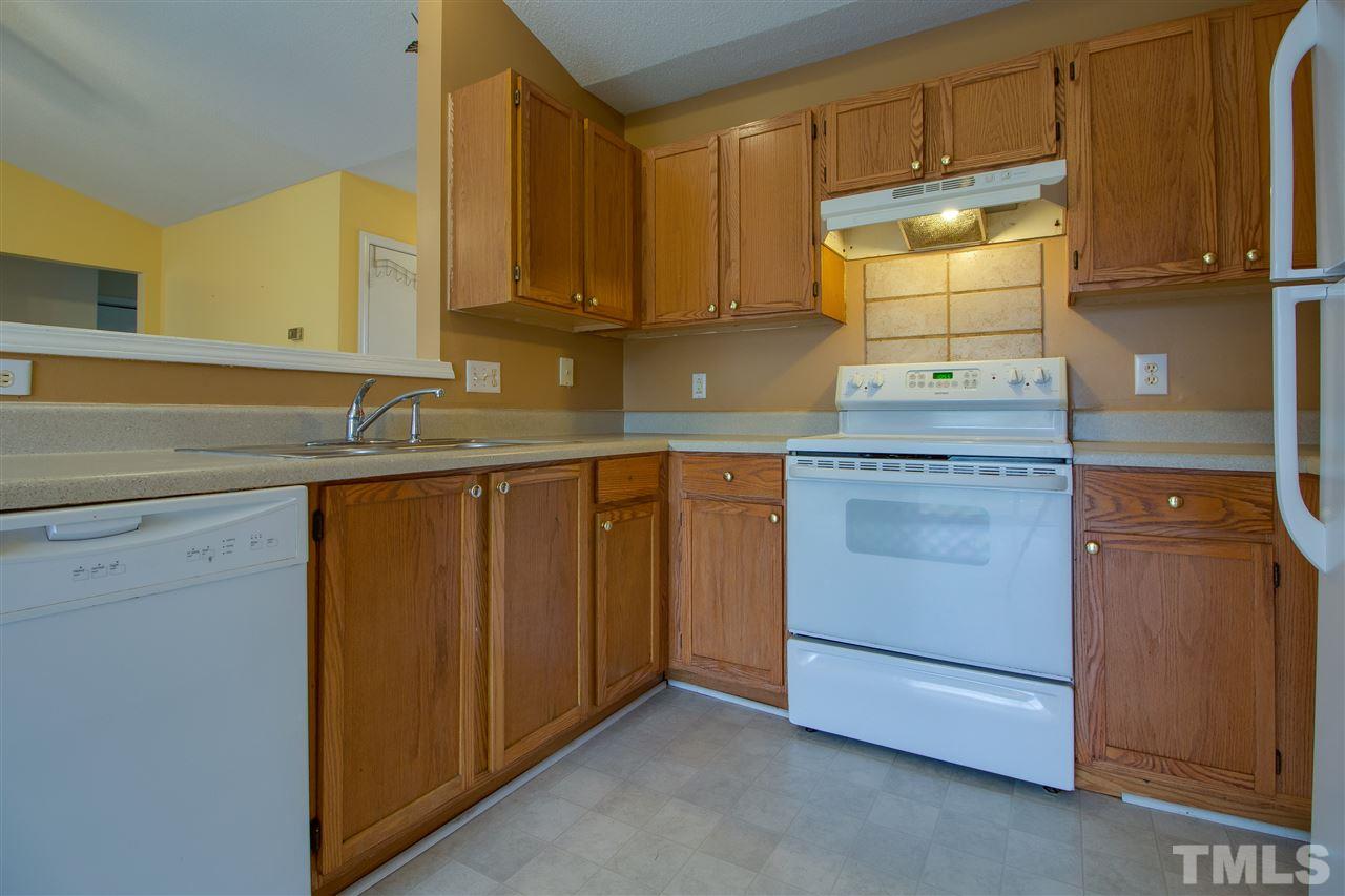 2905 Oneida Court Raleigh, NC 27610 - Photo 8 of 21 a kitchen with a sink and cabinets