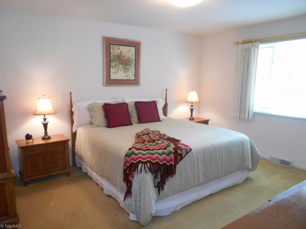 134 Old Mill Road High Point, NC 27265 - Photo 14 of 25 Master Bedroom is very roomy. It lets in lots of natural light, features a walk in closet and an en suite master bath.