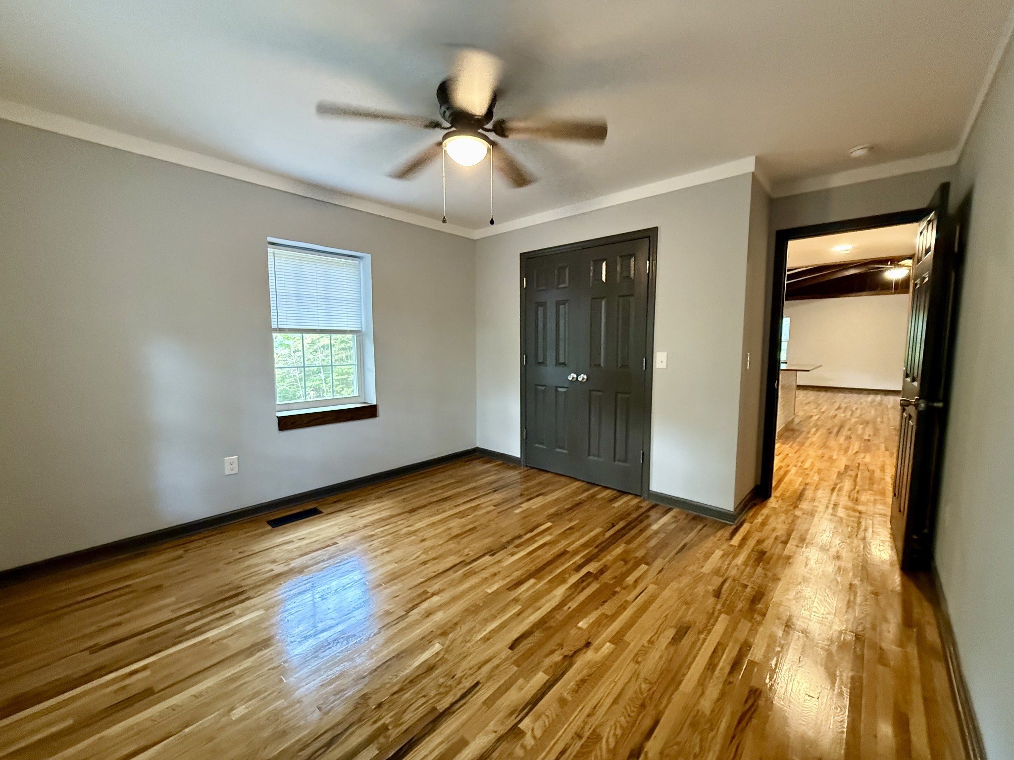 9388 Harrison Ferry Road McMinnville, TN 37110 - Photo 16 of 50 wooden floor in an empty room with a window